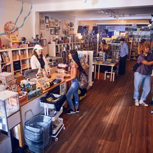 zoomed out shot of people browsing in a bookstore
