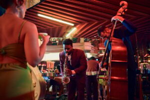 A saxophonist and a bassist duet in a swanky bar