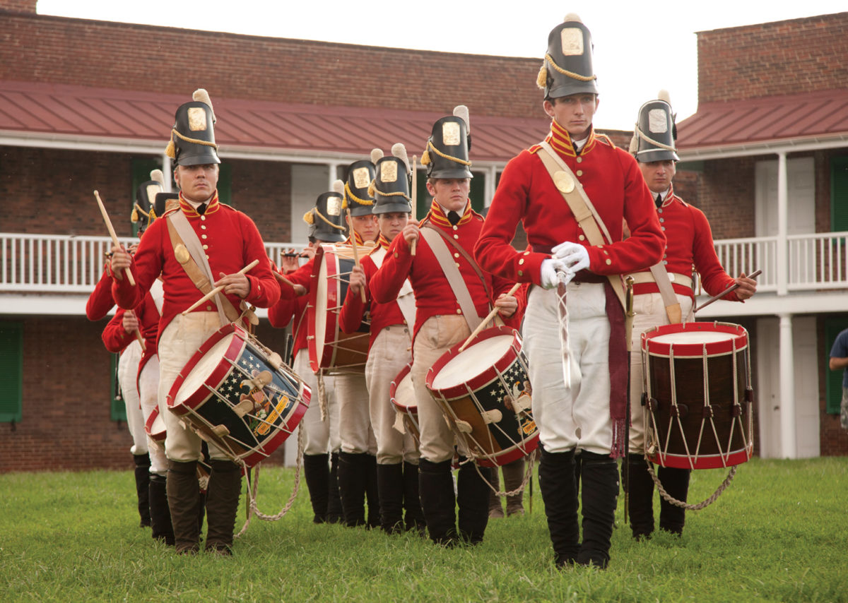 Farbs march behind the ramparts of Fort McHenry.