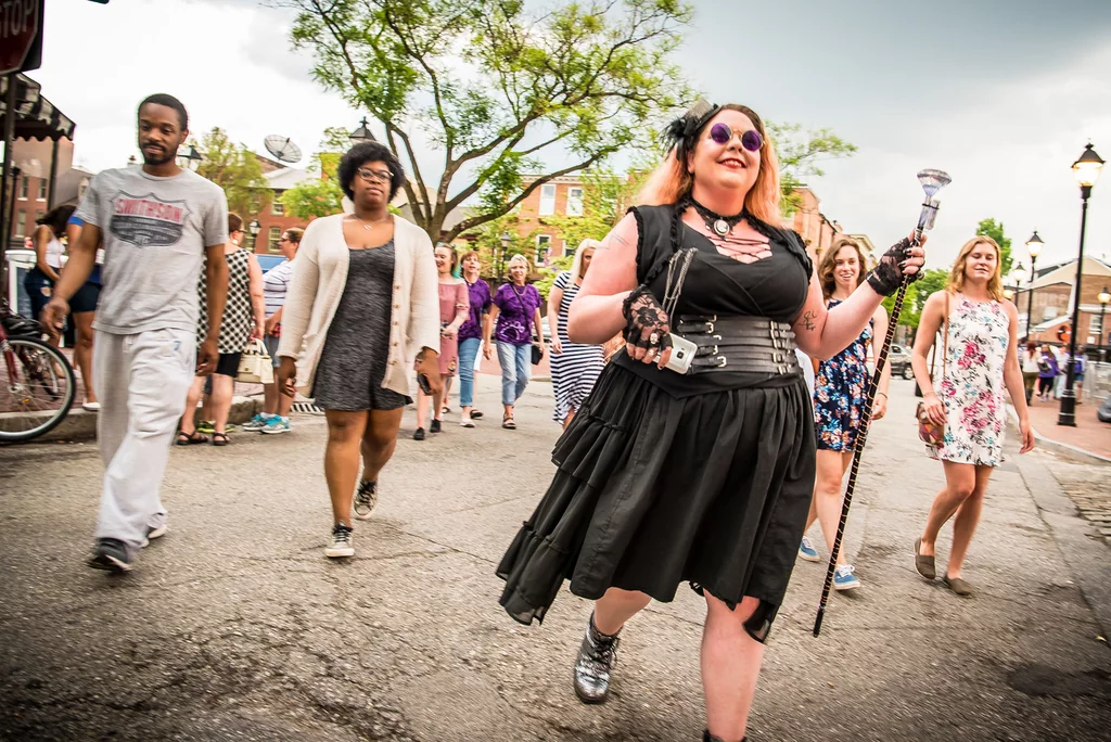 People walking on a tour through the street