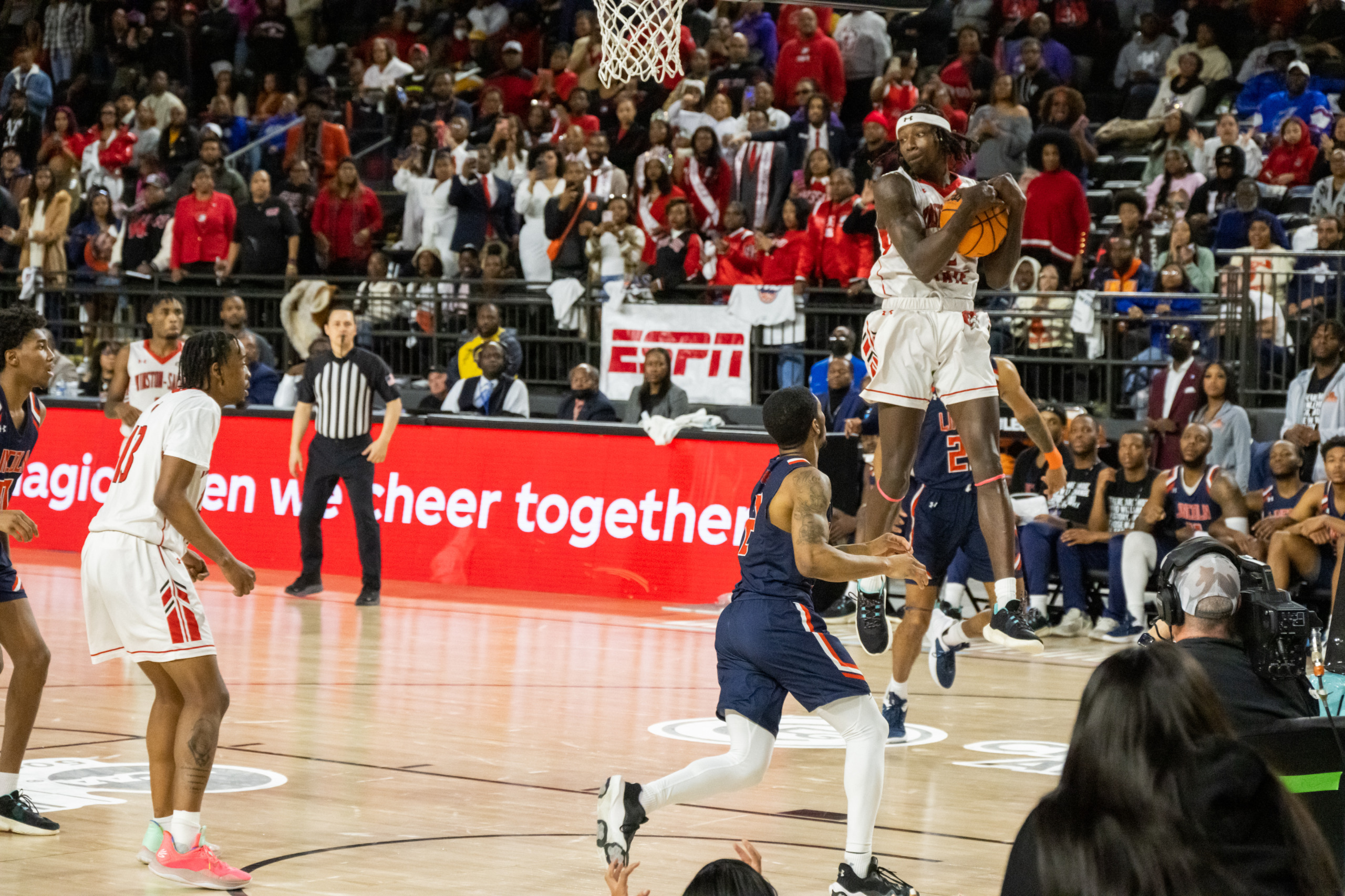 Male basketball players in action
