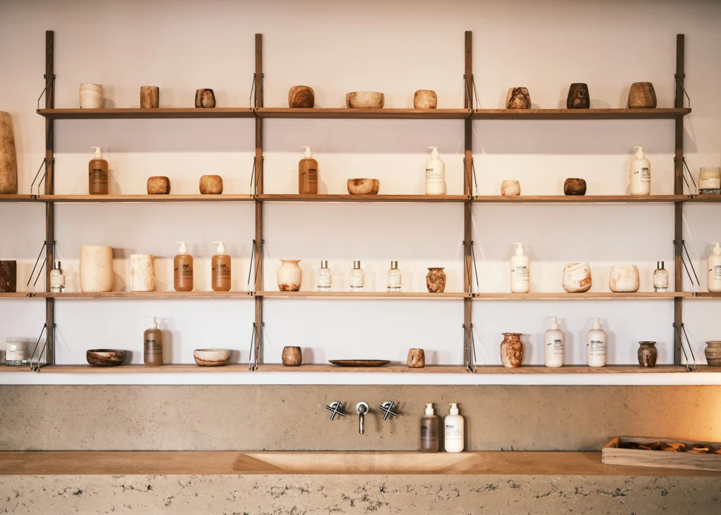 Wall of beauty products in a bathroom