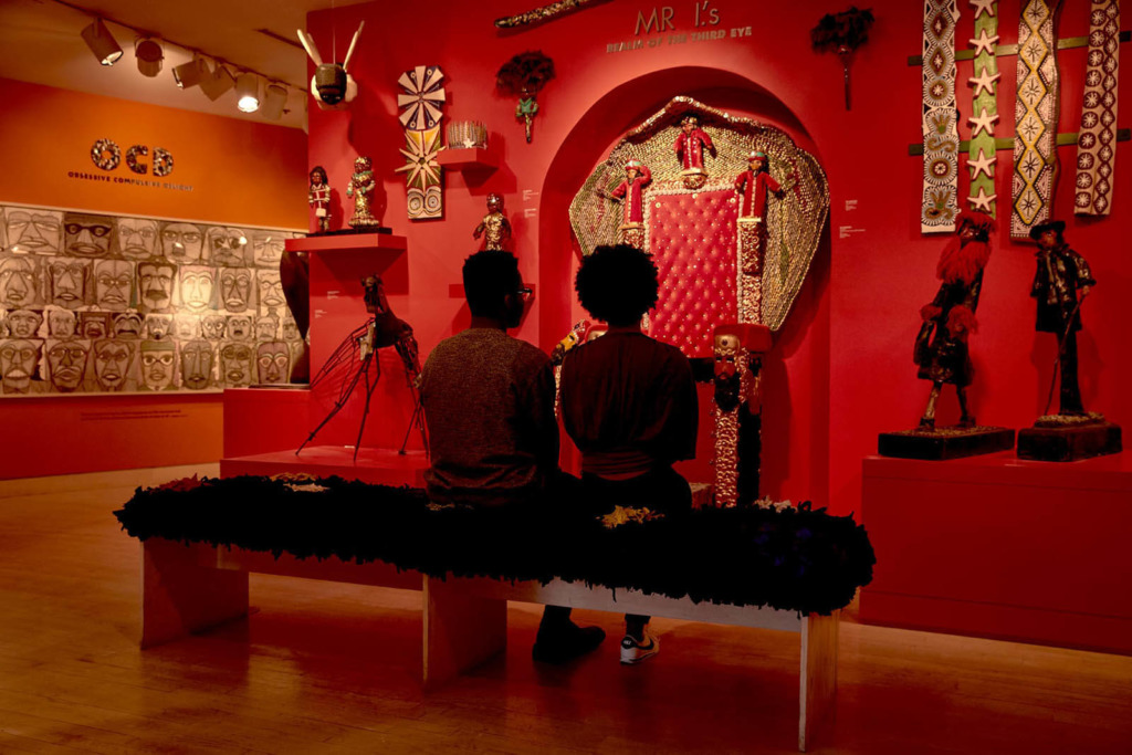 Two people look at an interior exhibition at AVAM in Baltimore.