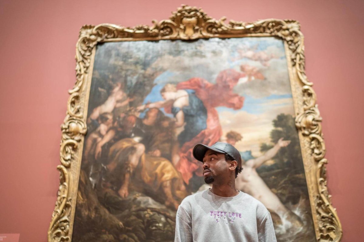 Kondwani Fidel in front of art at The Baltimore Museum of Art.