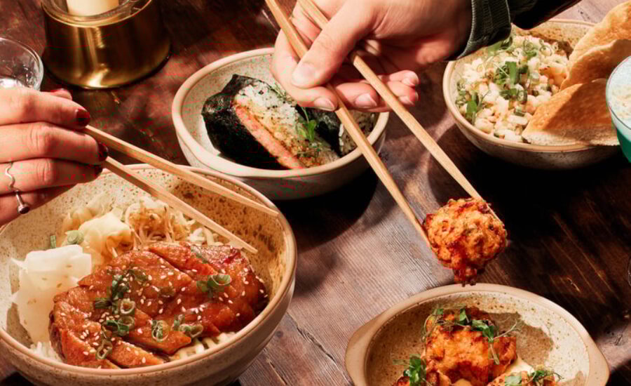 person skating at a skate park with the baltimore skyline in the background