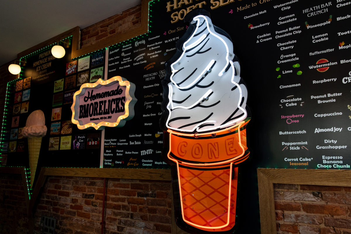 an illuminated ice cream cone sign at Bmore Licks