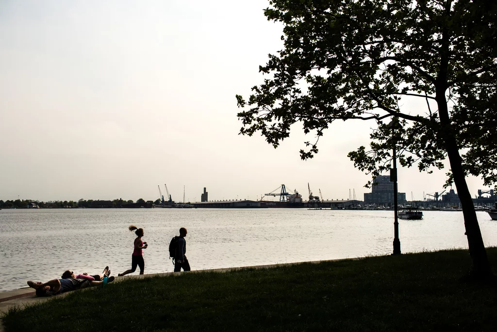 People running along waterfront