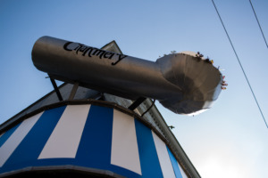 Ice cream scoop sign in front of The Charmery