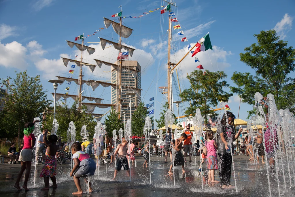Kids playing in water fountain
