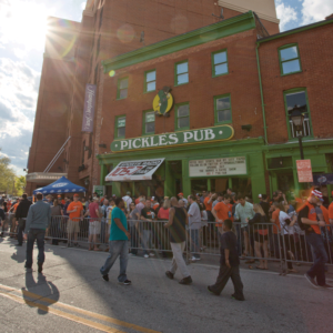 Crowd of people gathered outside Pickles Pub